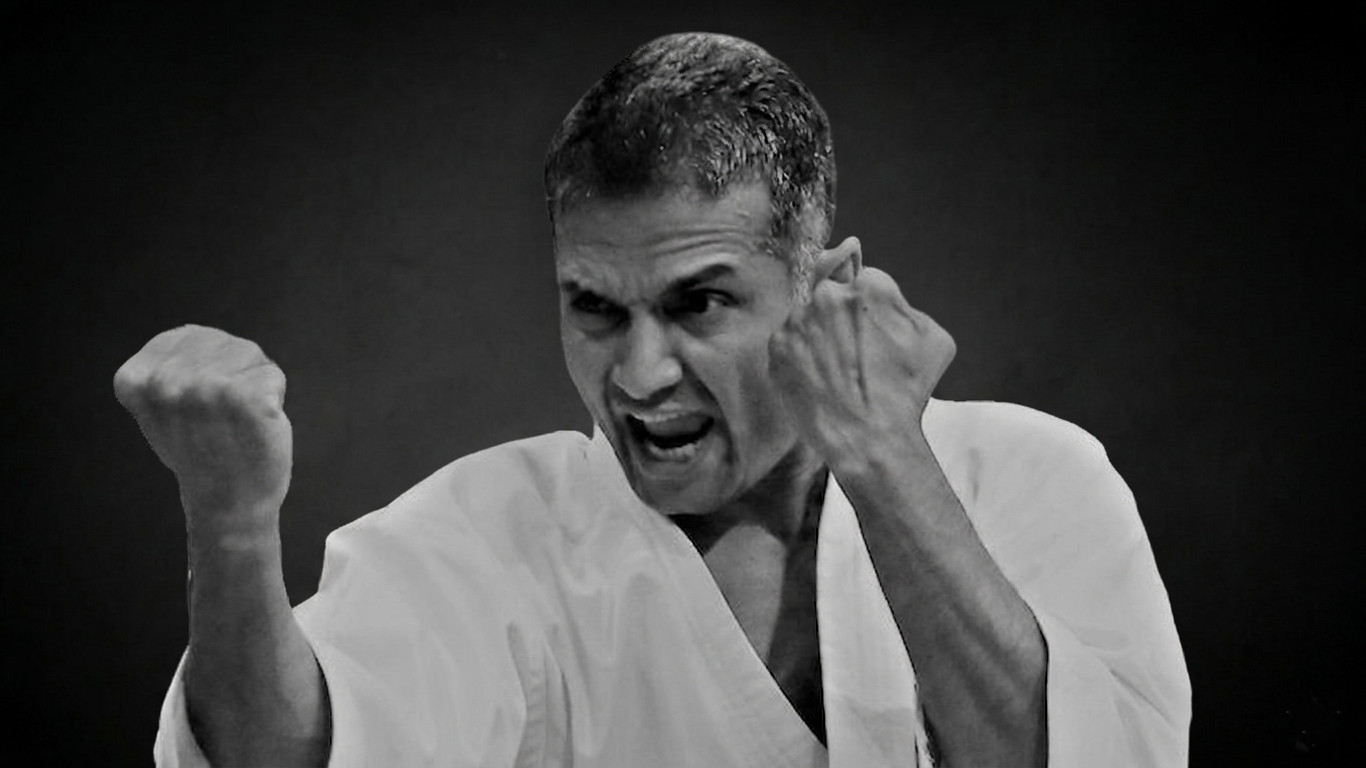 Karate practitioner mid-kick